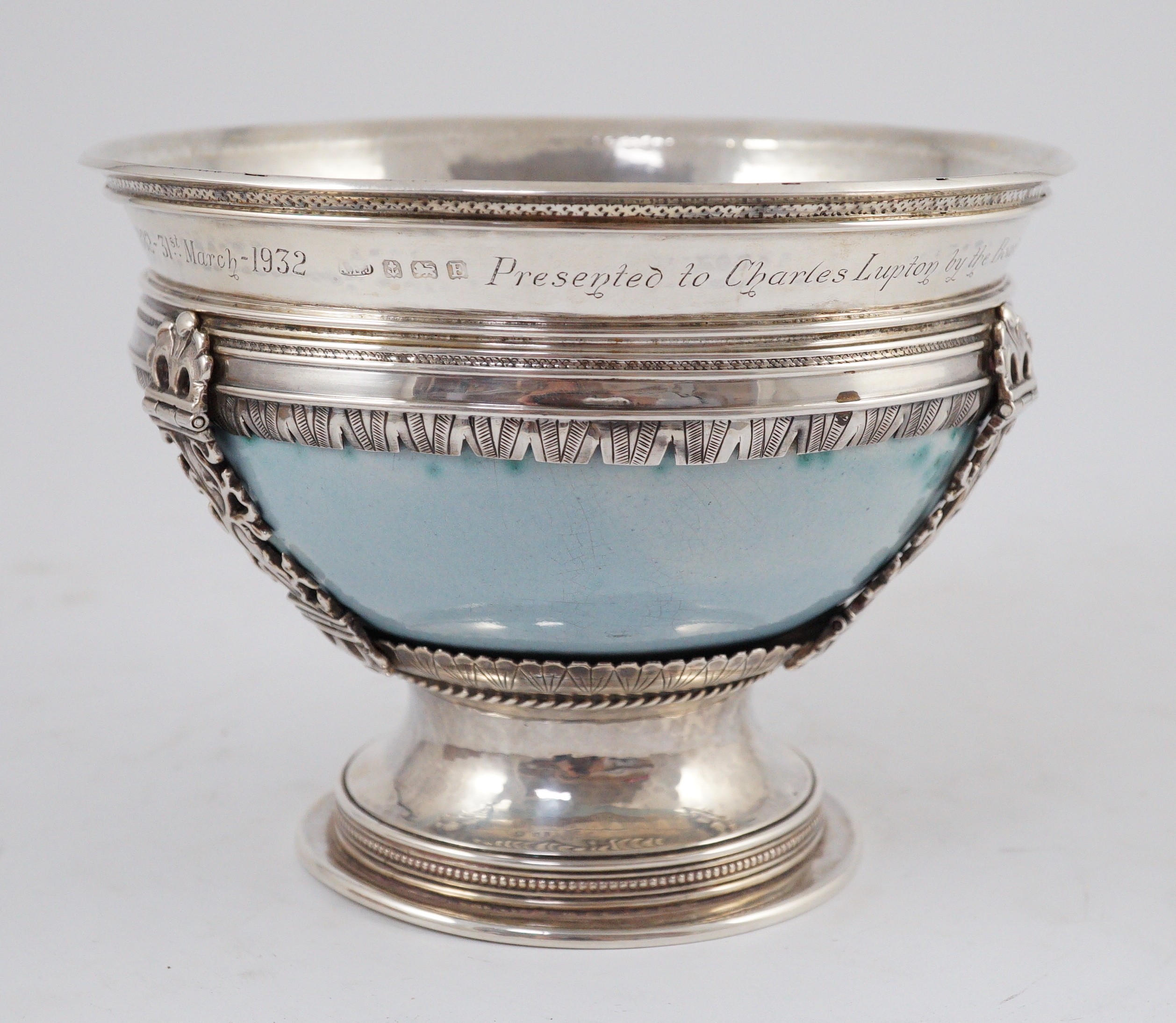 An Arts and Crafts silver mounted Ruskin pottery pedestal bowl, the silver mounts by A.E. Jones, Birmingham 1929, 16.5cm diameter